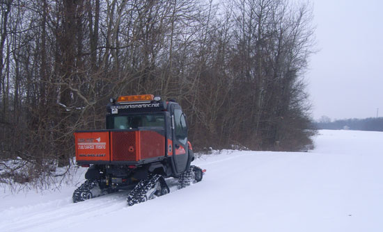 Tracked RTV-1100 rear view in winter conditions